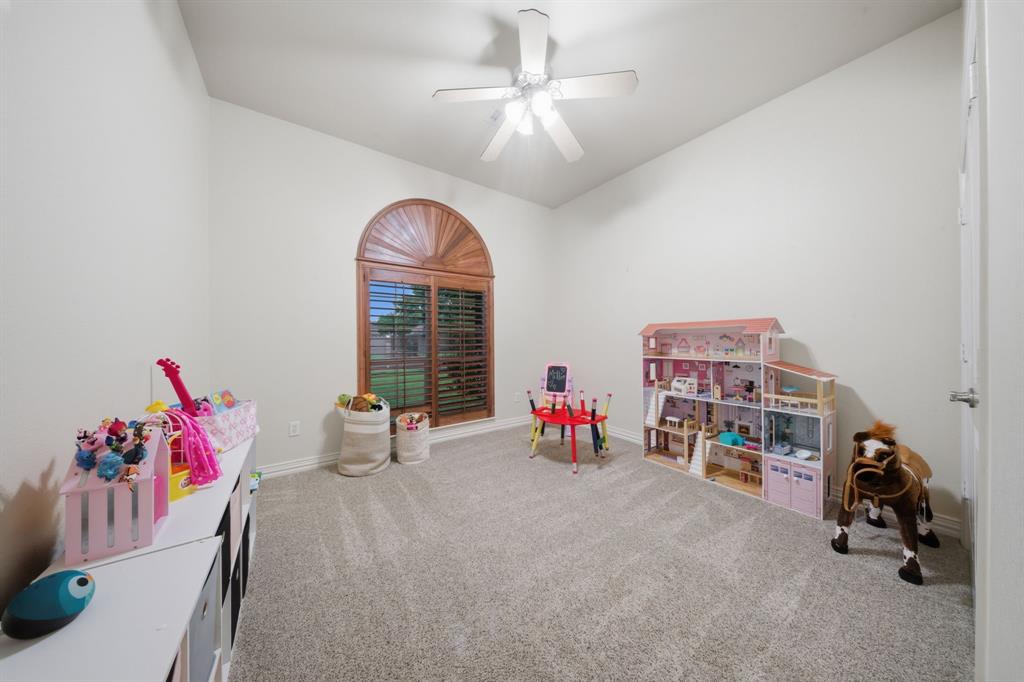603 Cedar Drive Pilot Point, TX 76258 - Photo 26 of 39 Room featuring sloped ceilings, a ceiling fan, and carpet flooring