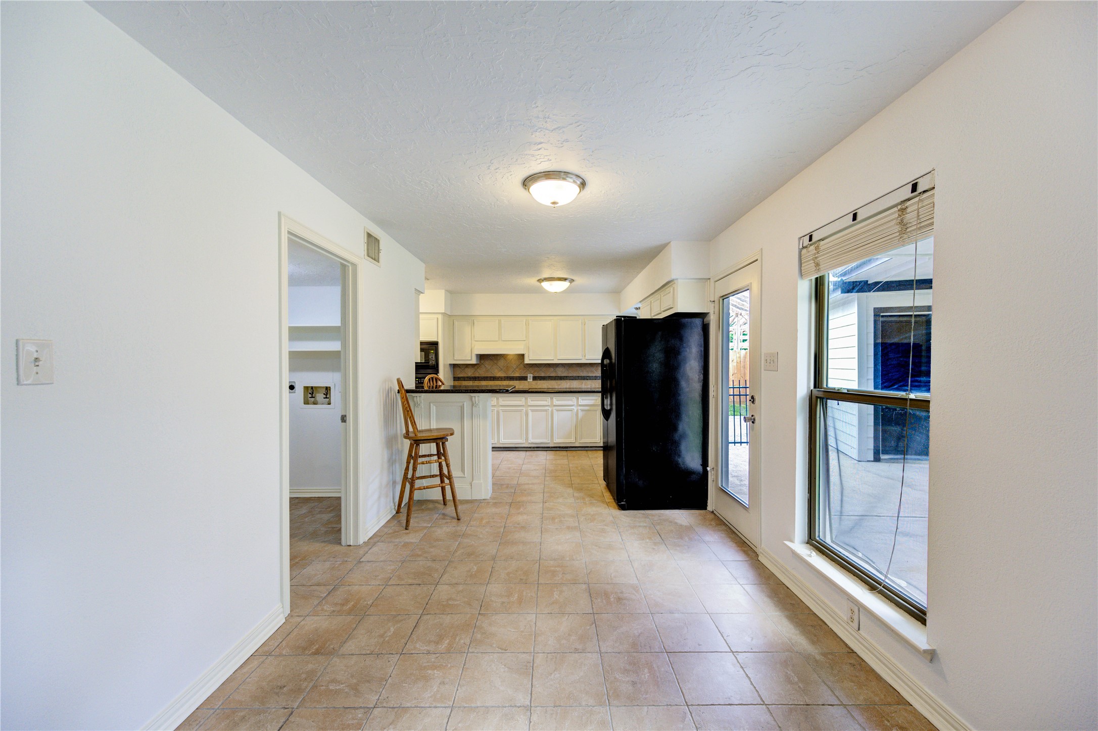 3639 Fir Forest Drive Spring, TX 77388 - Photo 17 of 44 a large kitchen with a refrigerator and a stove top oven