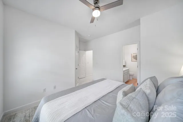 a bathroom with a sink toilet and mirror