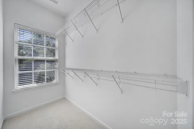 a view of a house with backyard and garden