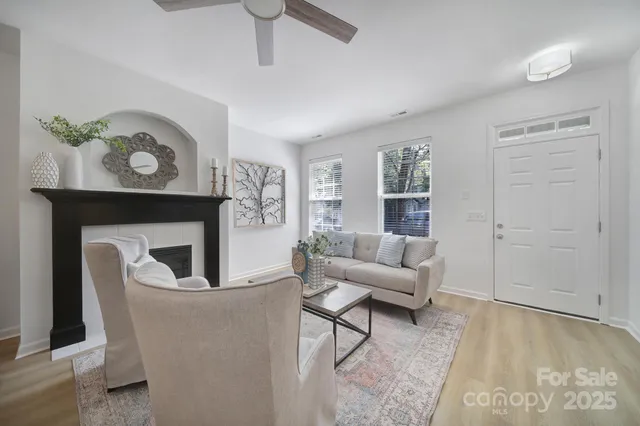 a living room with furniture and a fireplace