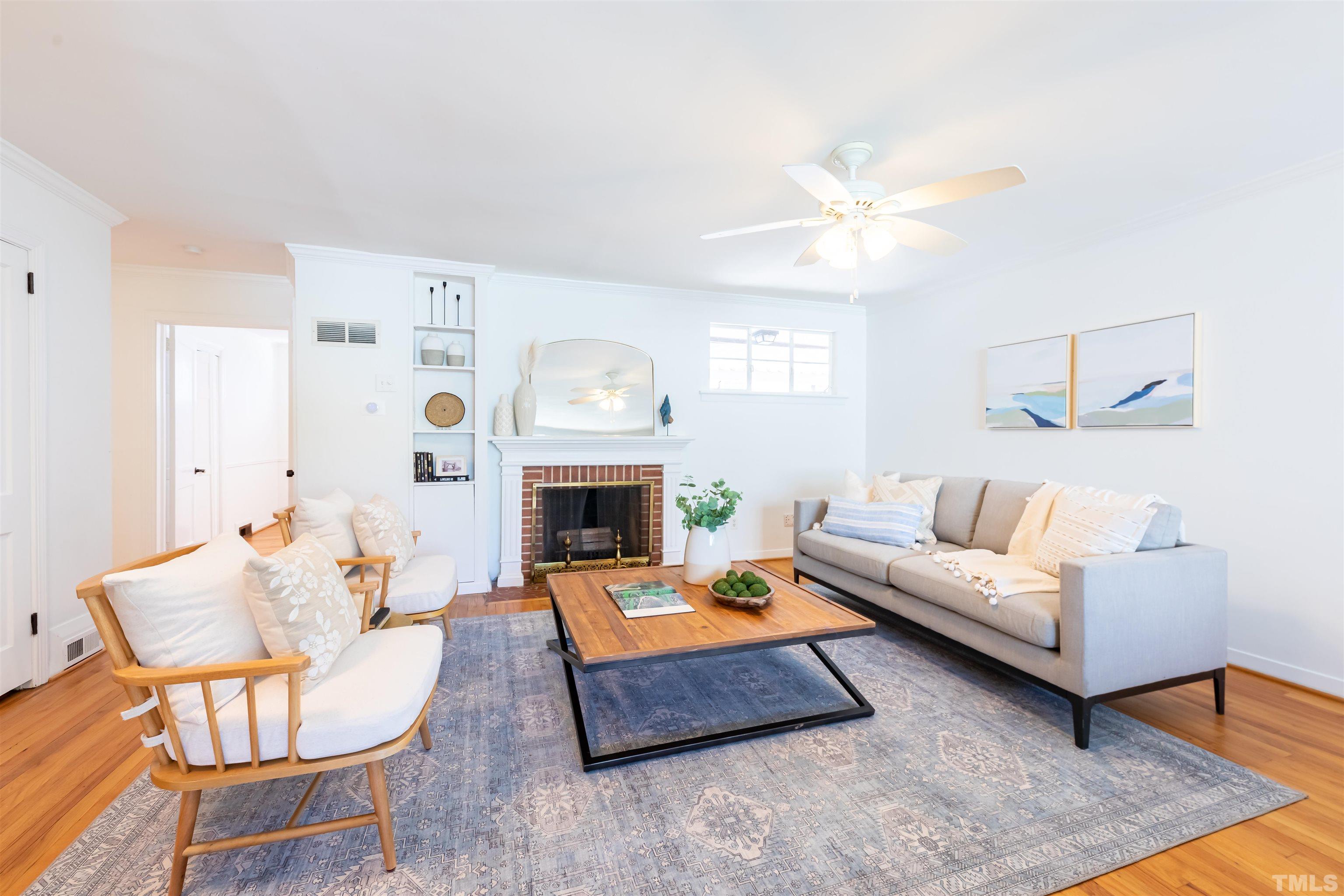 1433 Chester Road Raleigh, NC 27608 - Photo 11 of 33 a living room with furniture and a fireplace