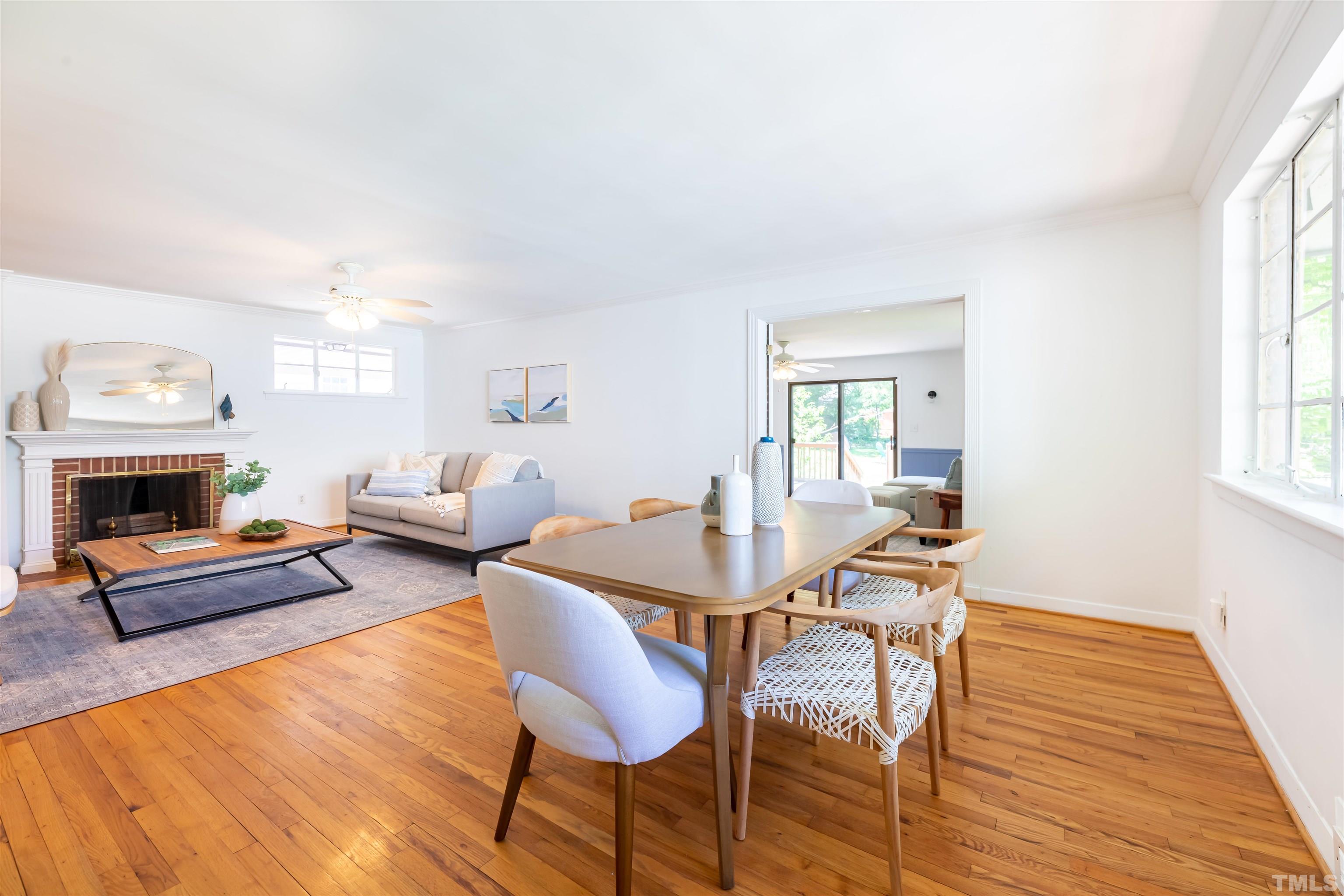 1433 Chester Road Raleigh, NC 27608 - Photo 12 of 33 a living room with furniture and a fireplace