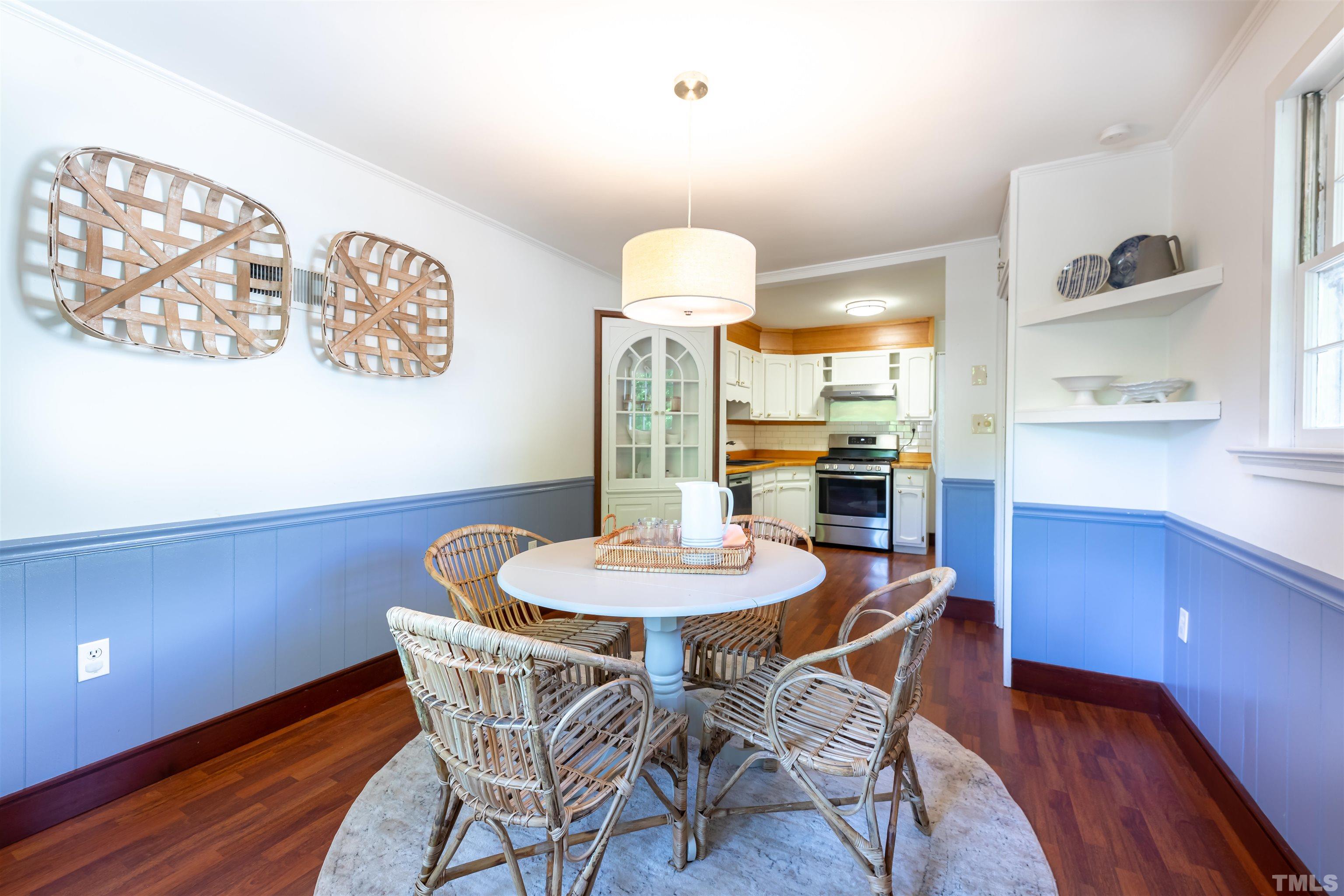 1433 Chester Road Raleigh, NC 27608 - Photo 16 of 33 a dining room with furniture and window