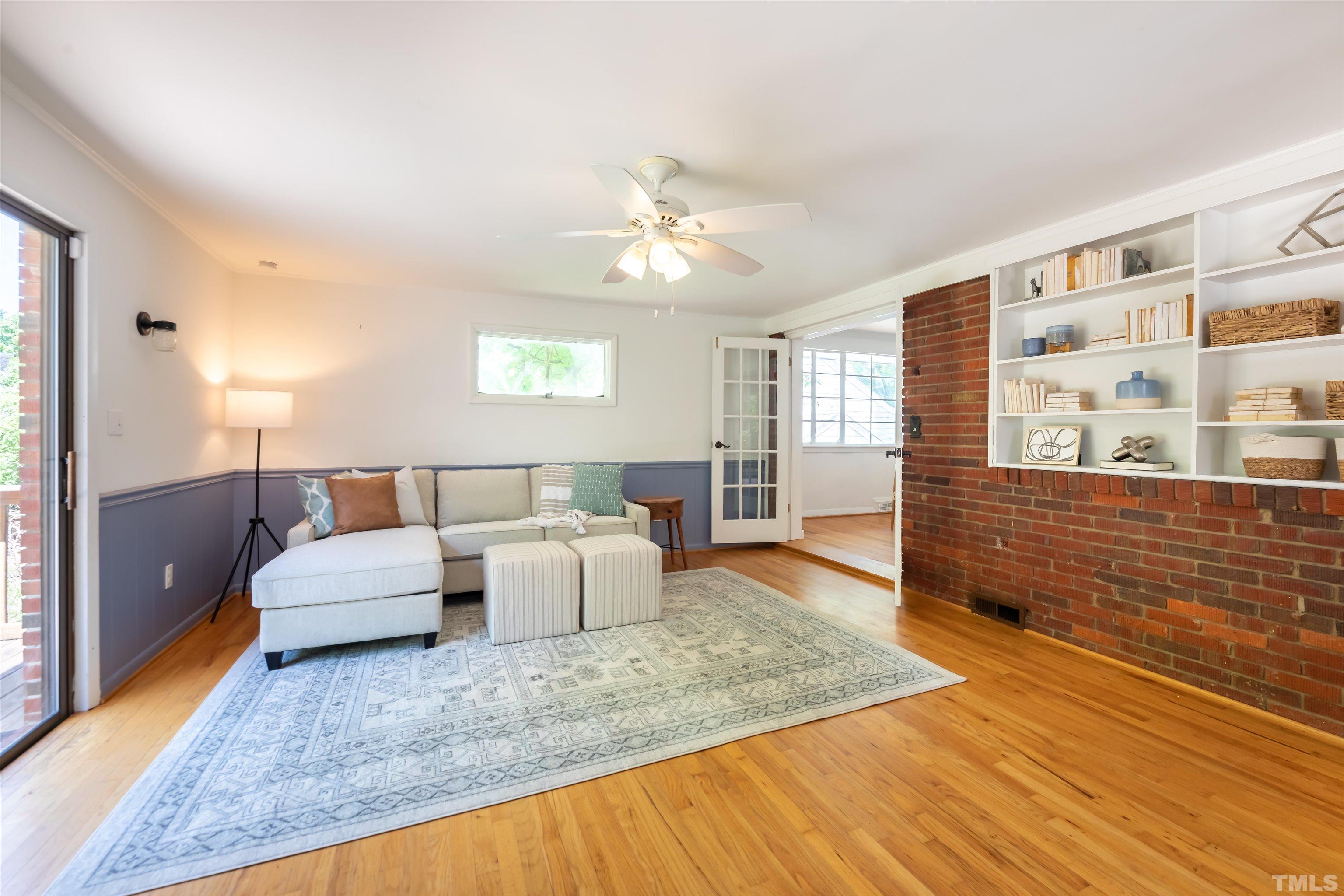 1433 Chester Road Raleigh, NC 27608 - Photo 23 of 33 a living room with furniture and wooden floor