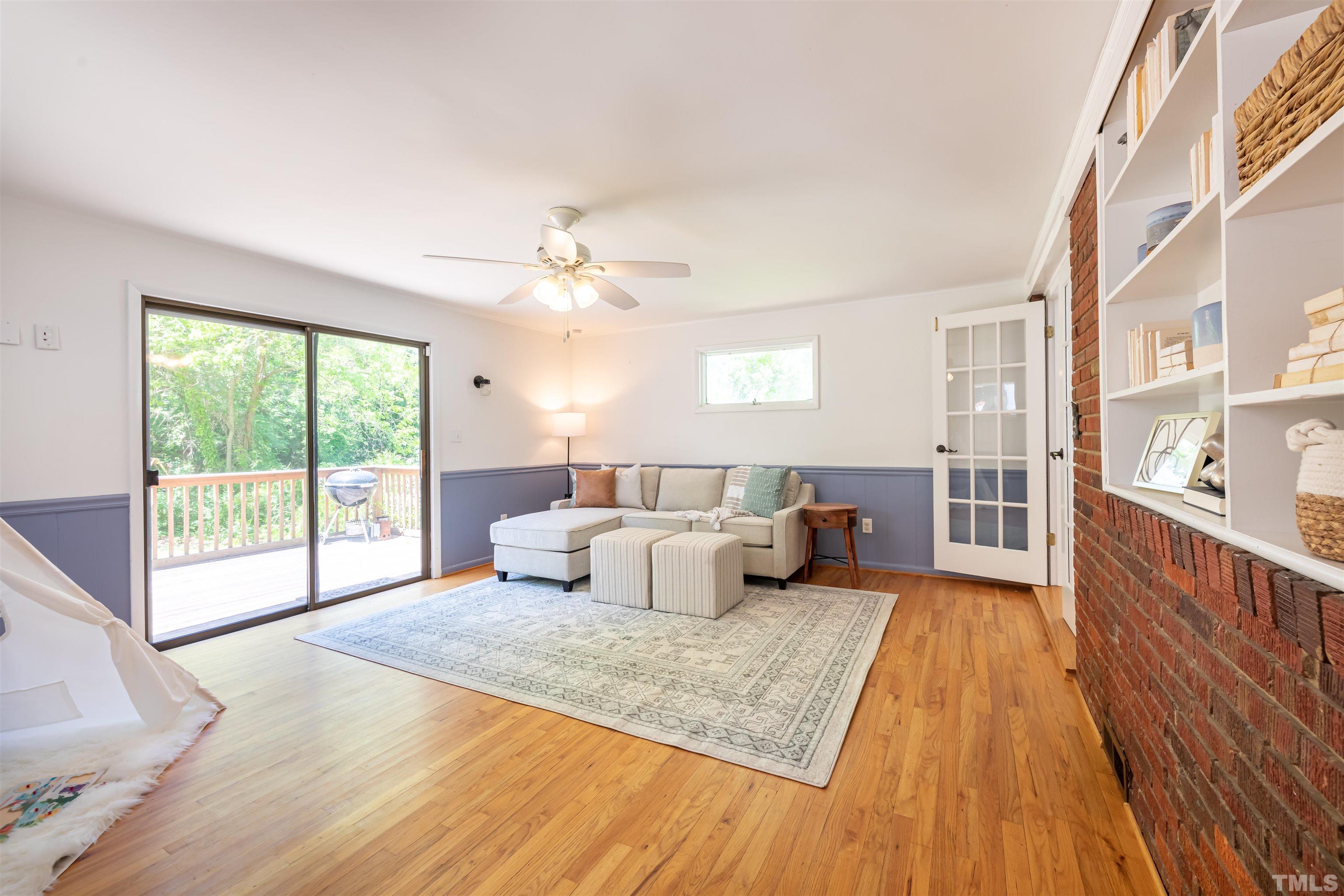 1433 Chester Road Raleigh, NC 27608 - Photo 24 of 33 a spacious bedroom with a large bed and a large window