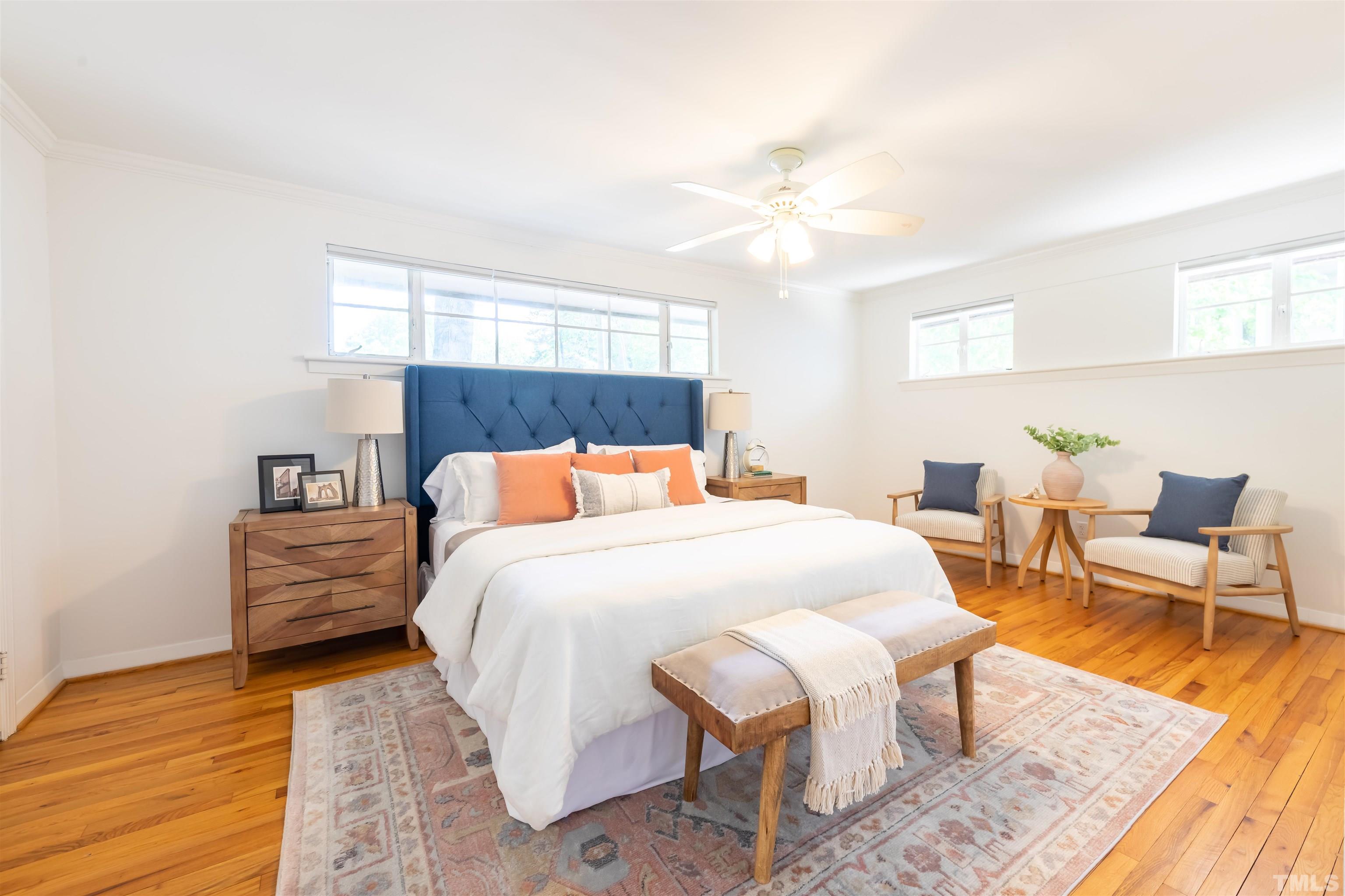 1433 Chester Road Raleigh, NC 27608 - Photo 28 of 33 a bedroom with a bed and wooden floor
