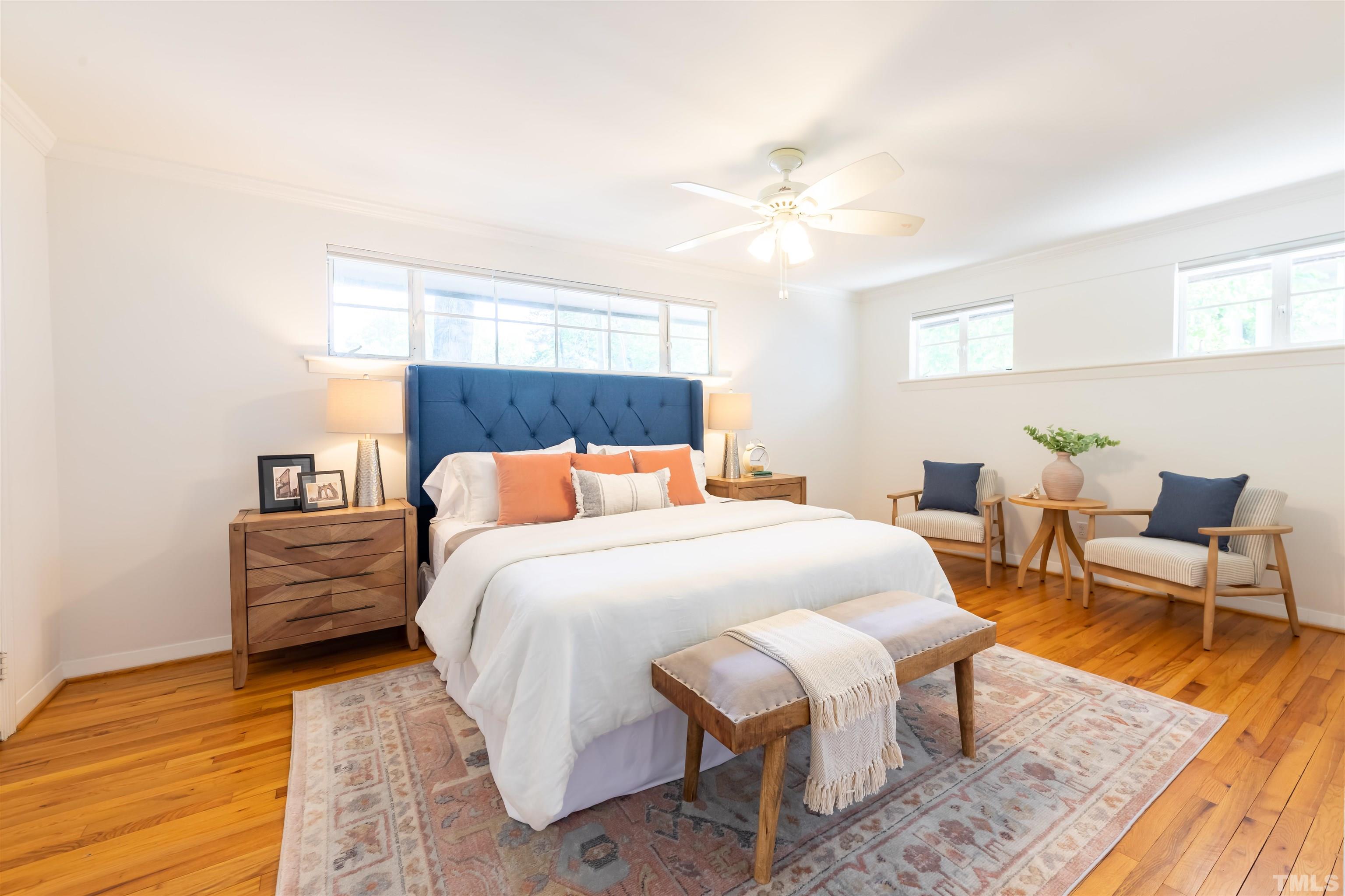 1433 Chester Road Raleigh, NC 27608 - Photo 29 of 33 a bedroom with a bed and wooden floor