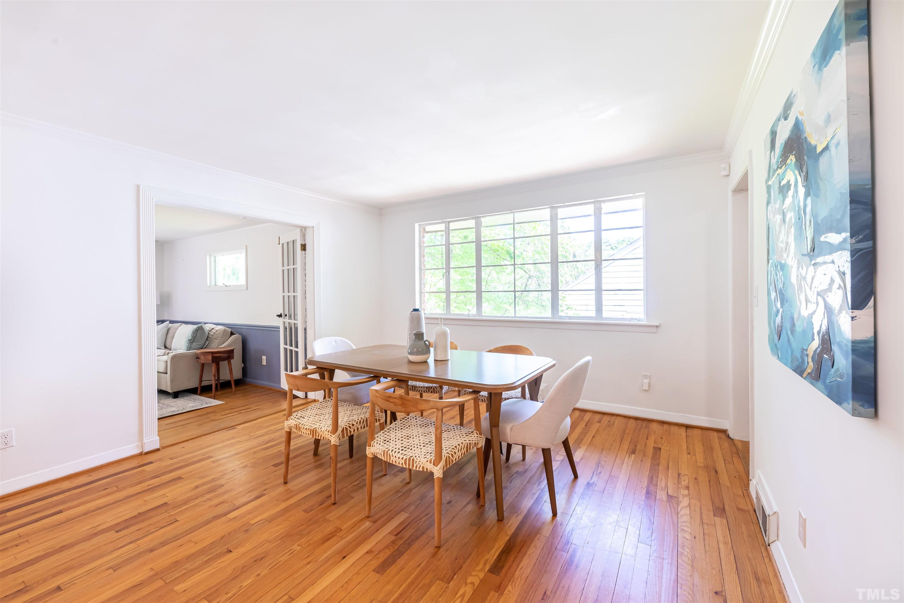 1433 Chester Road Raleigh, NC 27608 - Photo 8 of 33 a view of a dining room with furniture window and wooden floor