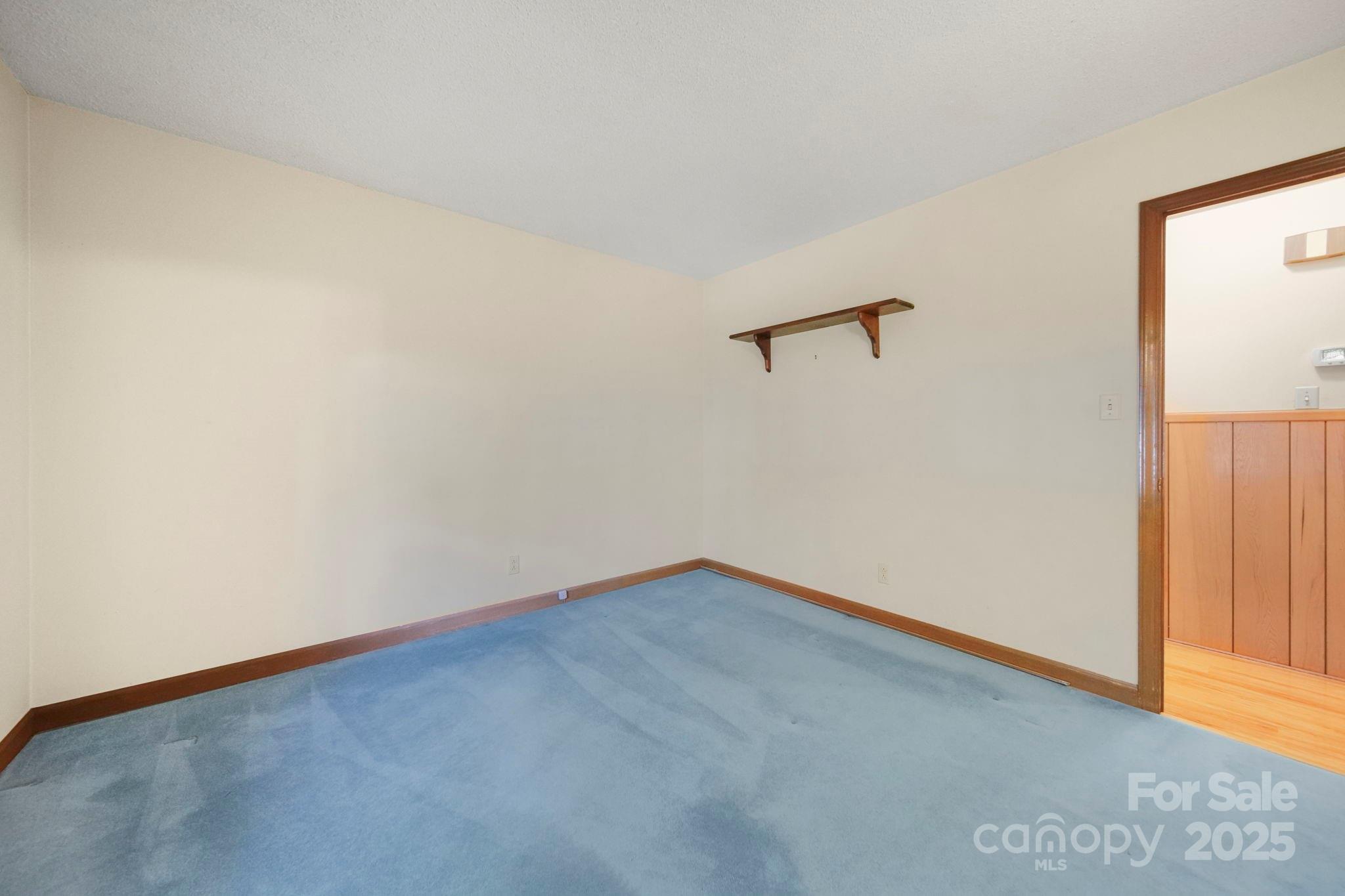 201 Smith Street, Unit 13 Wingate, NC 28174 - Photo 11 of 46 an empty room with a empty space and a window