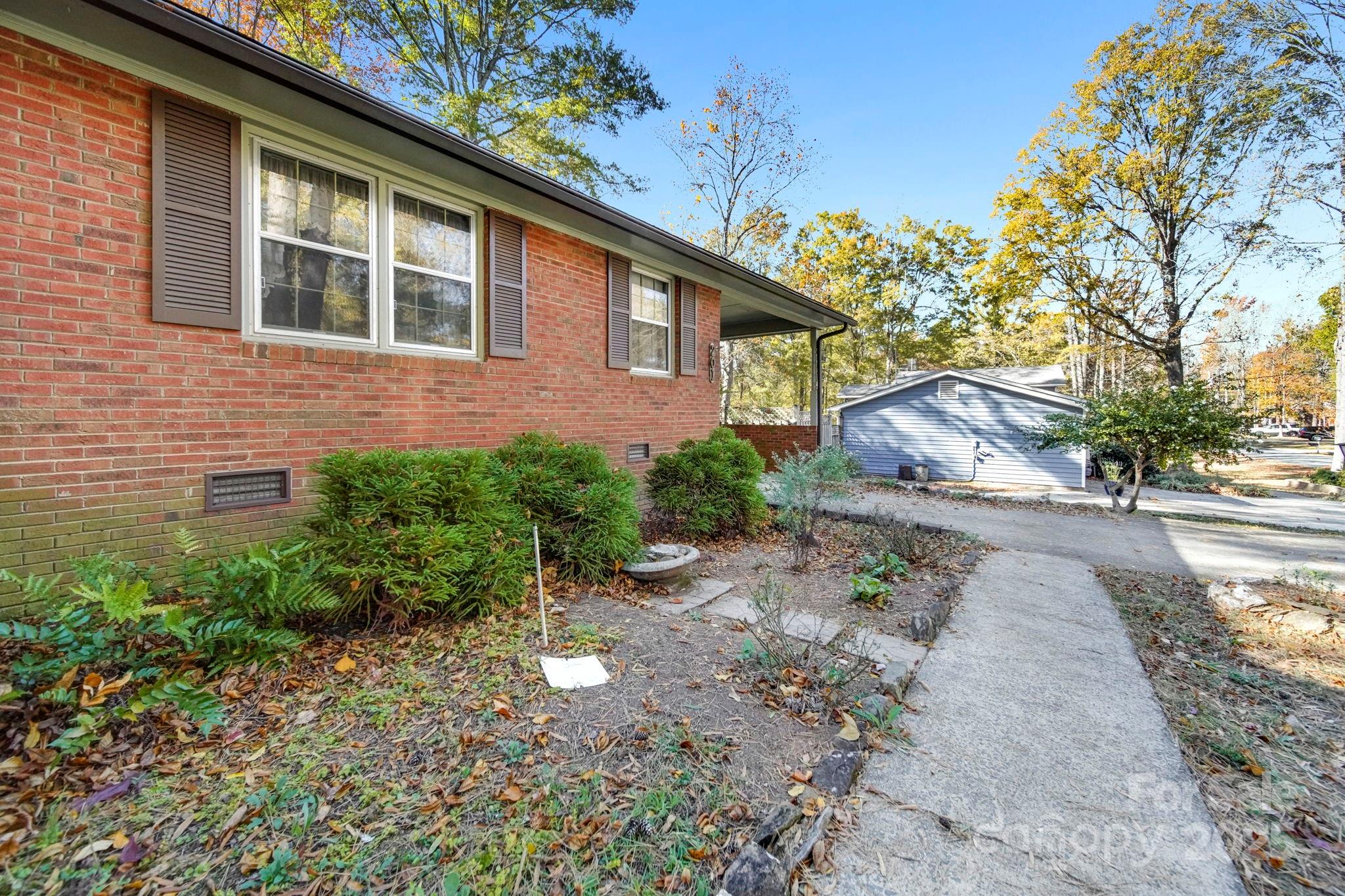 201 Smith Street, Unit 13 Wingate, NC 28174 - Photo 2 of 46 a view of a house with a yard