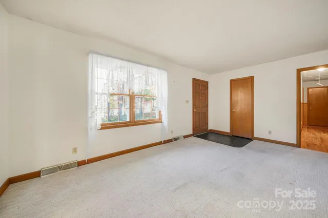 an empty room with windows