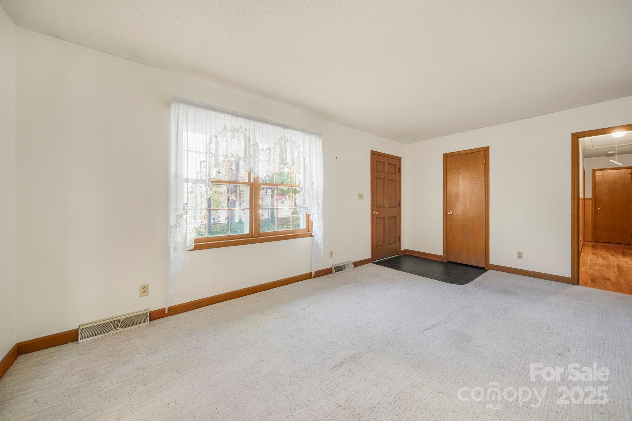 201 Smith Street, Unit 13 Wingate, NC 28174 - Photo 25 of 46 an empty room with windows