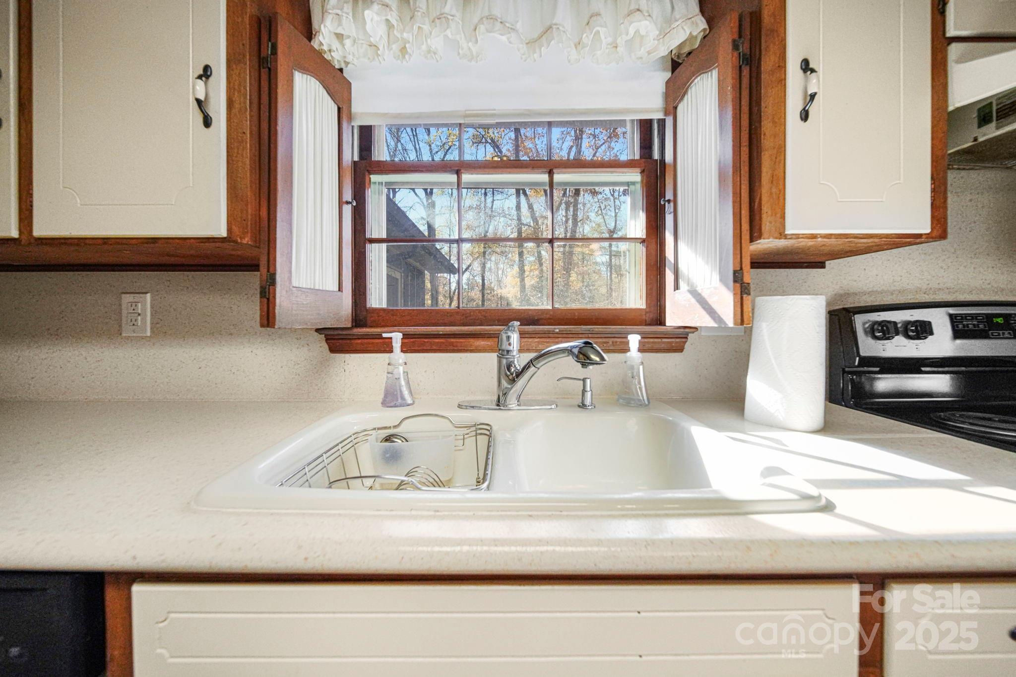 201 Smith Street, Unit 13 Wingate, NC 28174 - Photo 31 of 46 a kitchen with a sink and a window