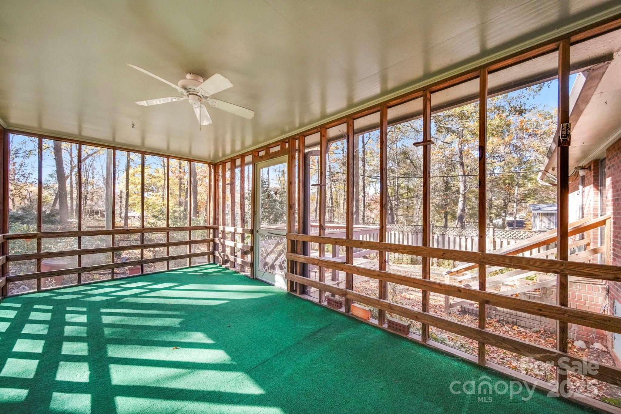 201 Smith Street, Unit 13 Wingate, NC 28174 - Photo 35 of 46 a view of an empty room with wooden floor and windows