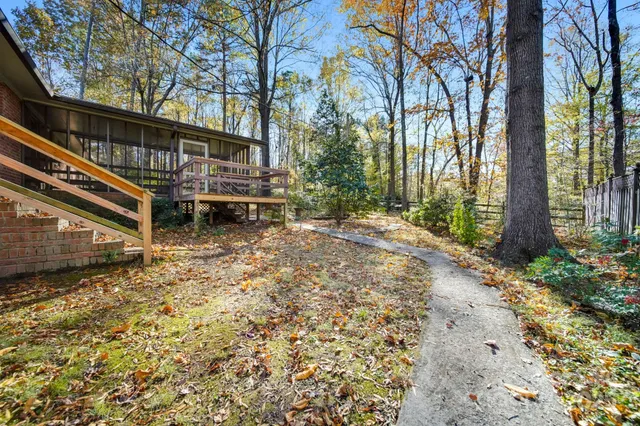a view of a outdoor space with a fountain and plants