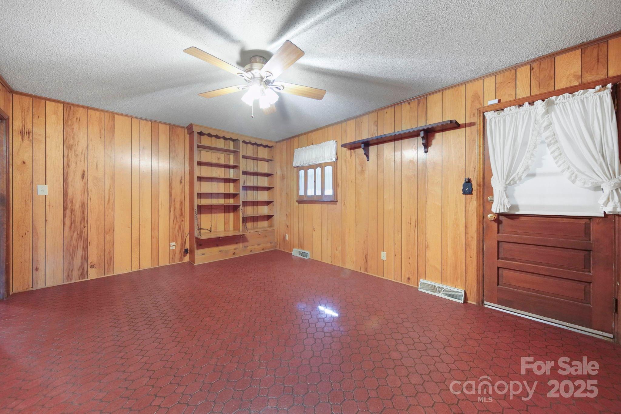 201 Smith Street, Unit 13 Wingate, NC 28174 - Photo 4 of 46 a view of an empty room with a window