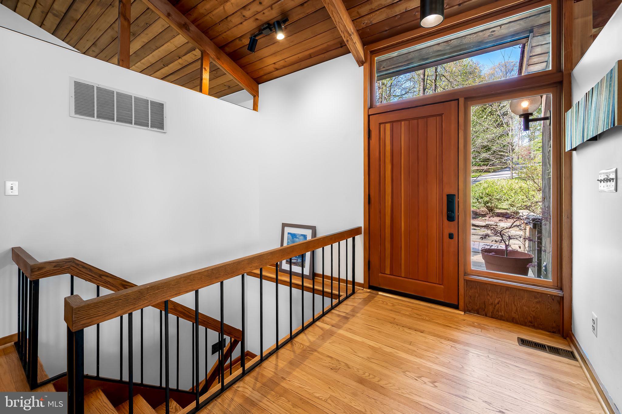 1115 High Country Road Towson, MD 21286 - Photo 4 of 71 a view of a hallway with wooden floor and staircase