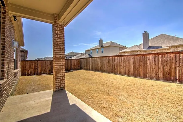 a view of a terrace with wooden fence