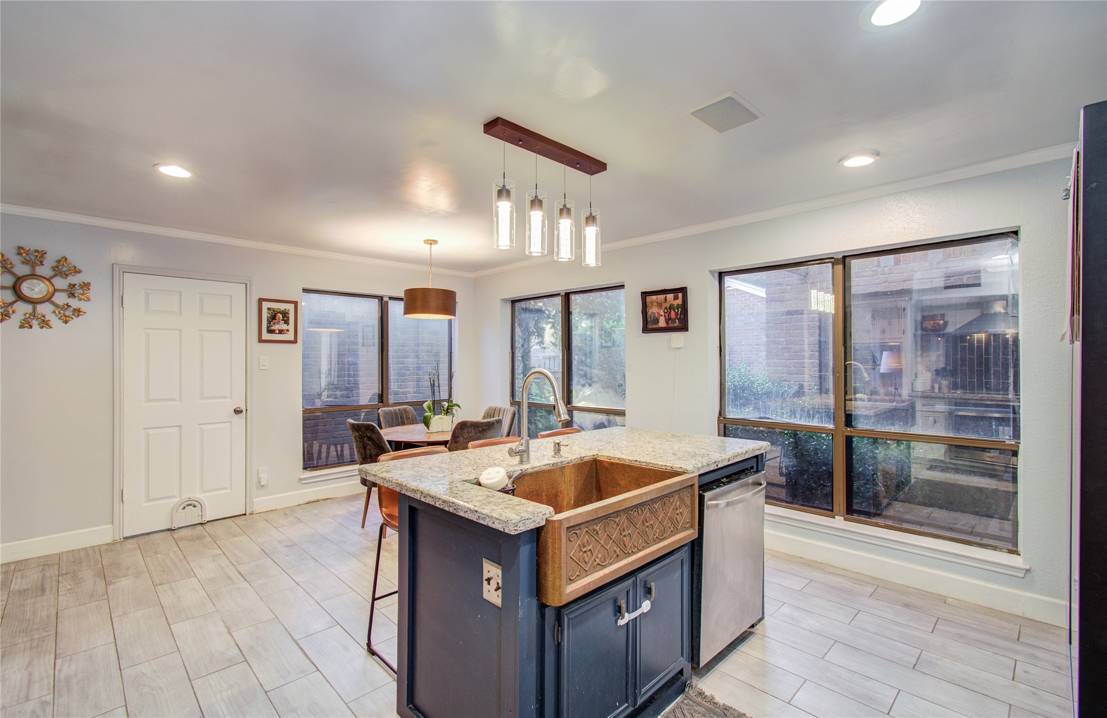 16707 Fernwood Way Houston, TX 77058 - Photo 13 of 46 a living room with stainless steel appliances granite countertop a sink and a refrigerator
