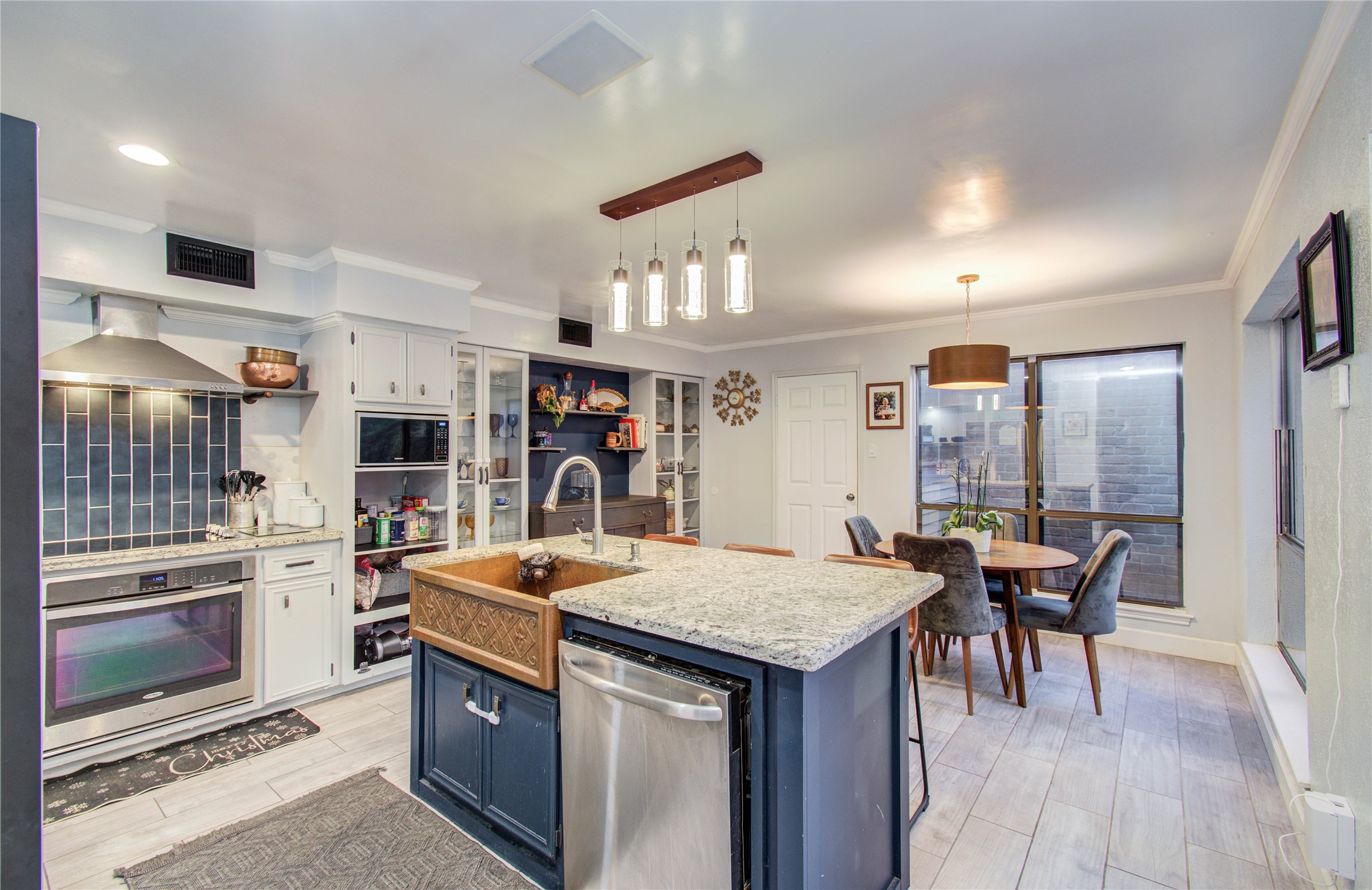 16707 Fernwood Way Houston, TX 77058 - Photo 14 of 46 a kitchen with a table and chairs