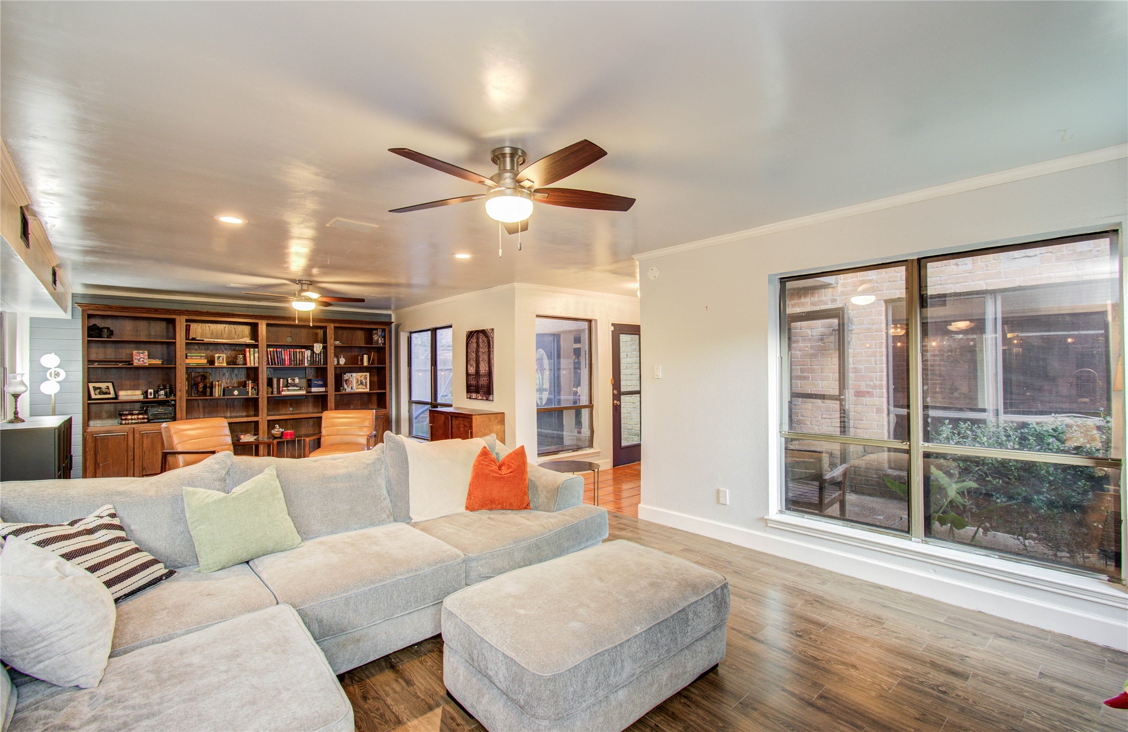 16707 Fernwood Way Houston, TX 77058 - Photo 2 of 46 a living room with furniture and a large window