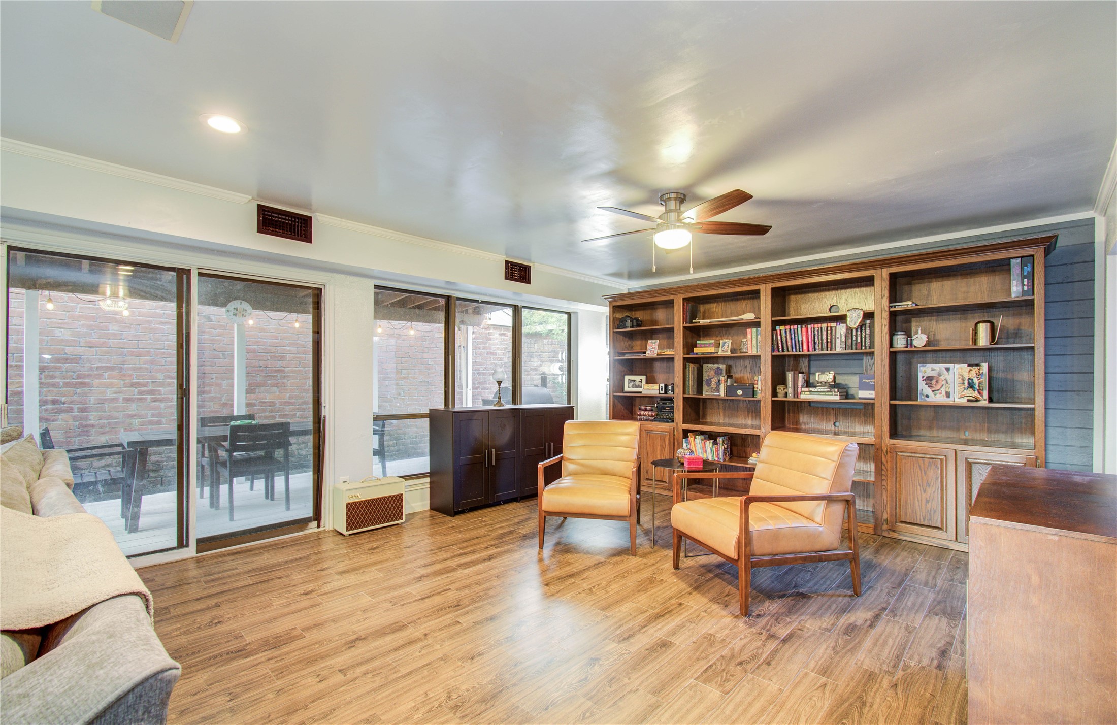 16707 Fernwood Way Houston, TX 77058 - Photo 24 of 46 a living room with furniture and a wooden floor
