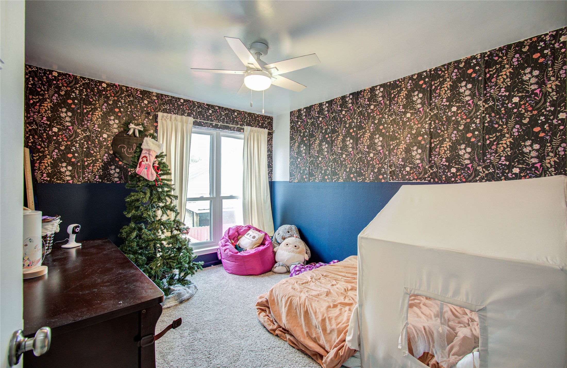 16707 Fernwood Way Houston, TX 77058 - Photo 27 of 46 a bedroom with furniture and a large window