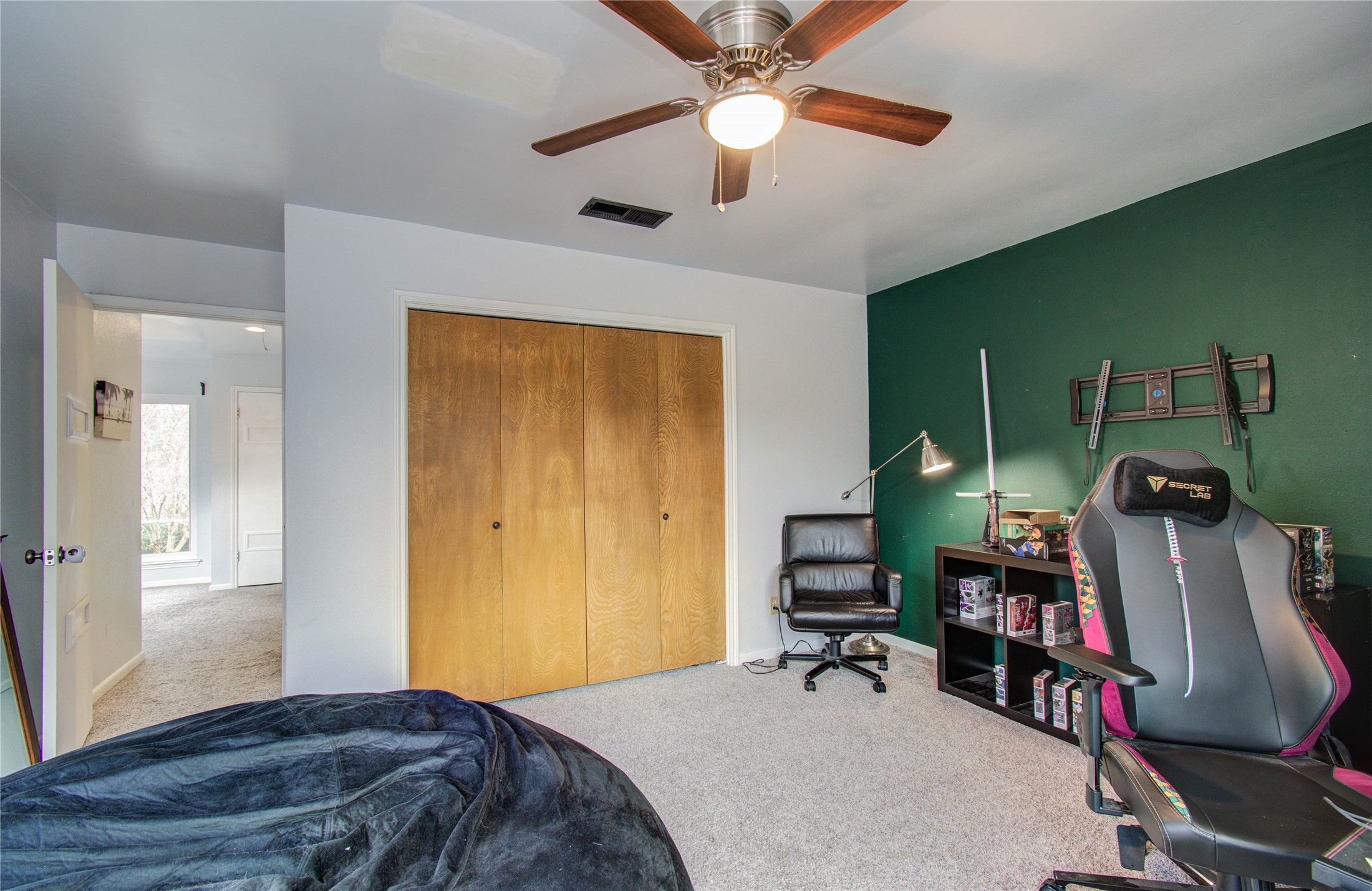 16707 Fernwood Way Houston, TX 77058 - Photo 31 of 46 a bedroom with bed and furniture