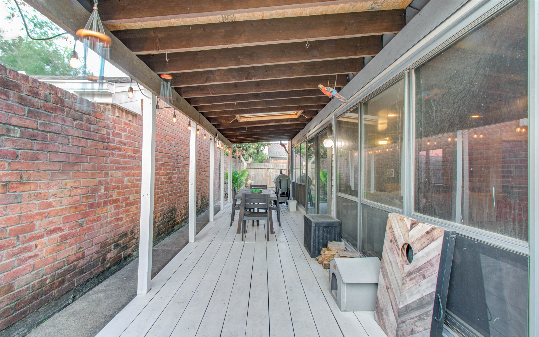 16707 Fernwood Way Houston, TX 77058 - Photo 41 of 46 a patio with wooden floor and outdoor seating
