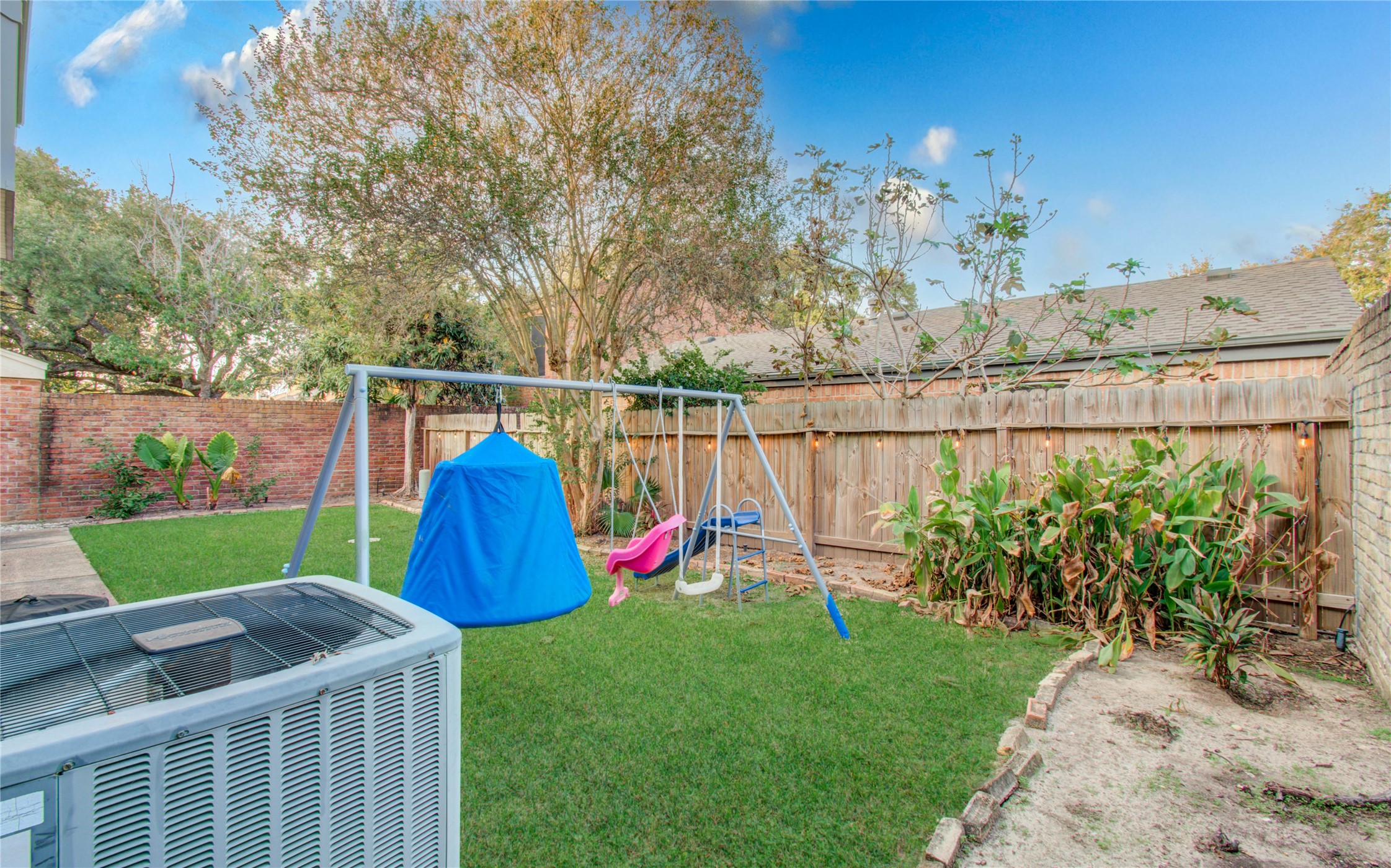 16707 Fernwood Way Houston, TX 77058 - Photo 45 of 46 a view of a backyard with a garden and entertaining space