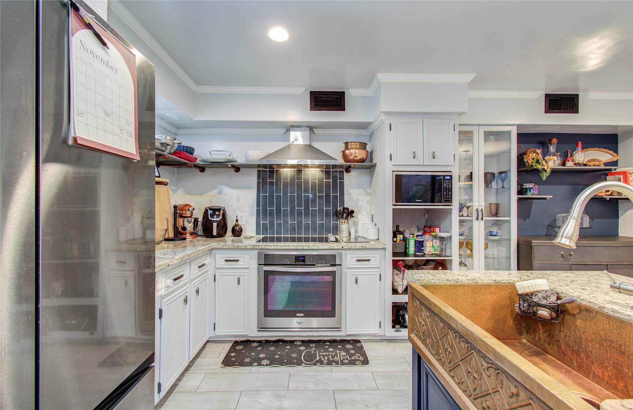 16707 Fernwood Way Houston, TX 77058 - Photo 5 of 46 a kitchen with stainless steel appliances granite countertop a sink stove and cabinets
