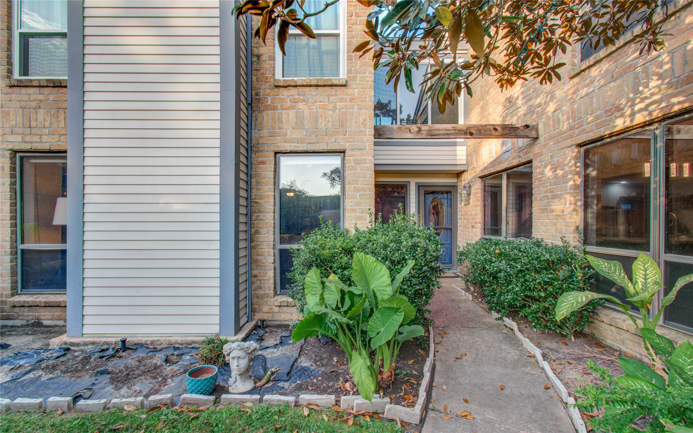 16707 Fernwood Way Houston, TX 77058 - Photo 10 of 46 a front view of a house with garden