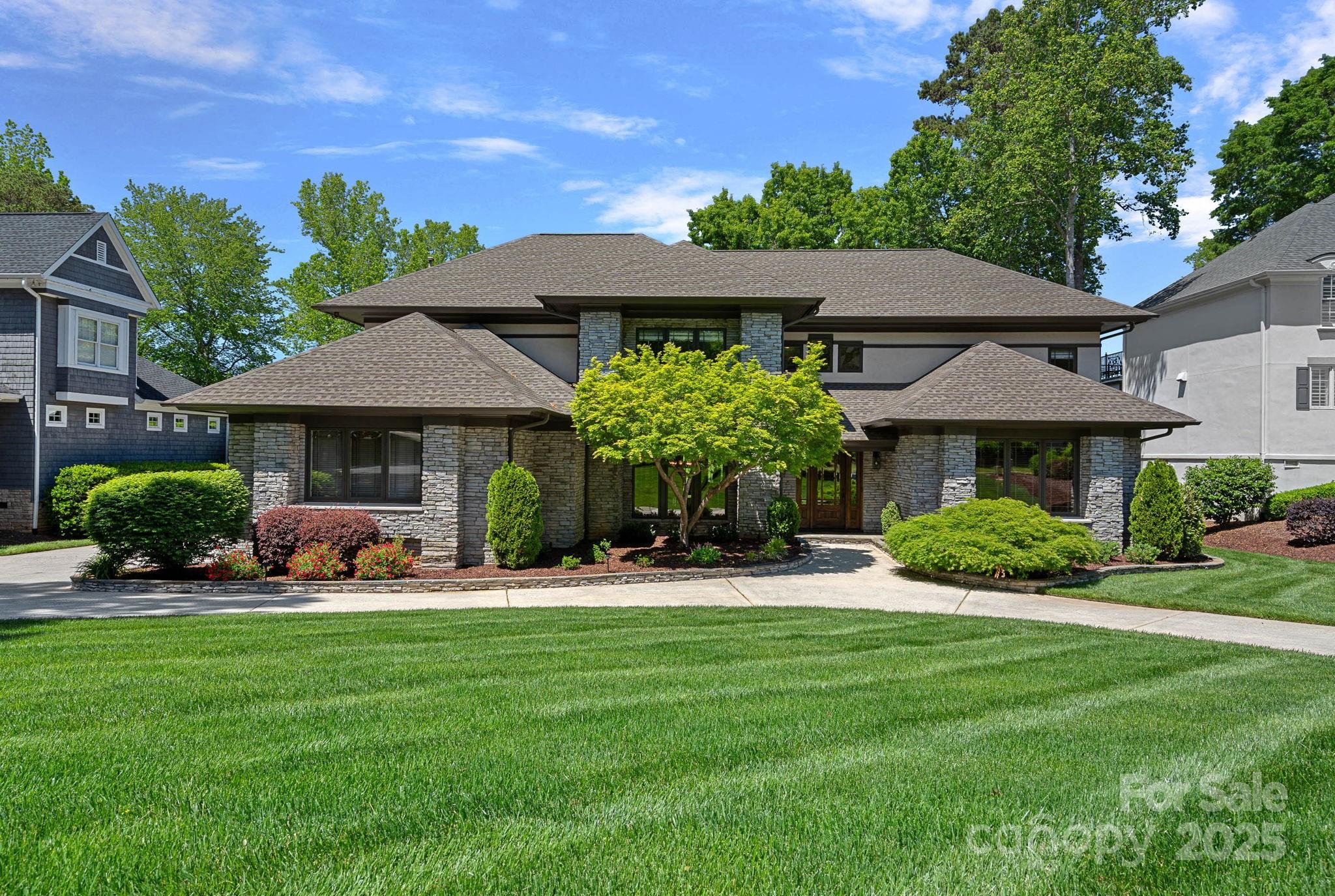 a front view of a house with a yard table and chairs