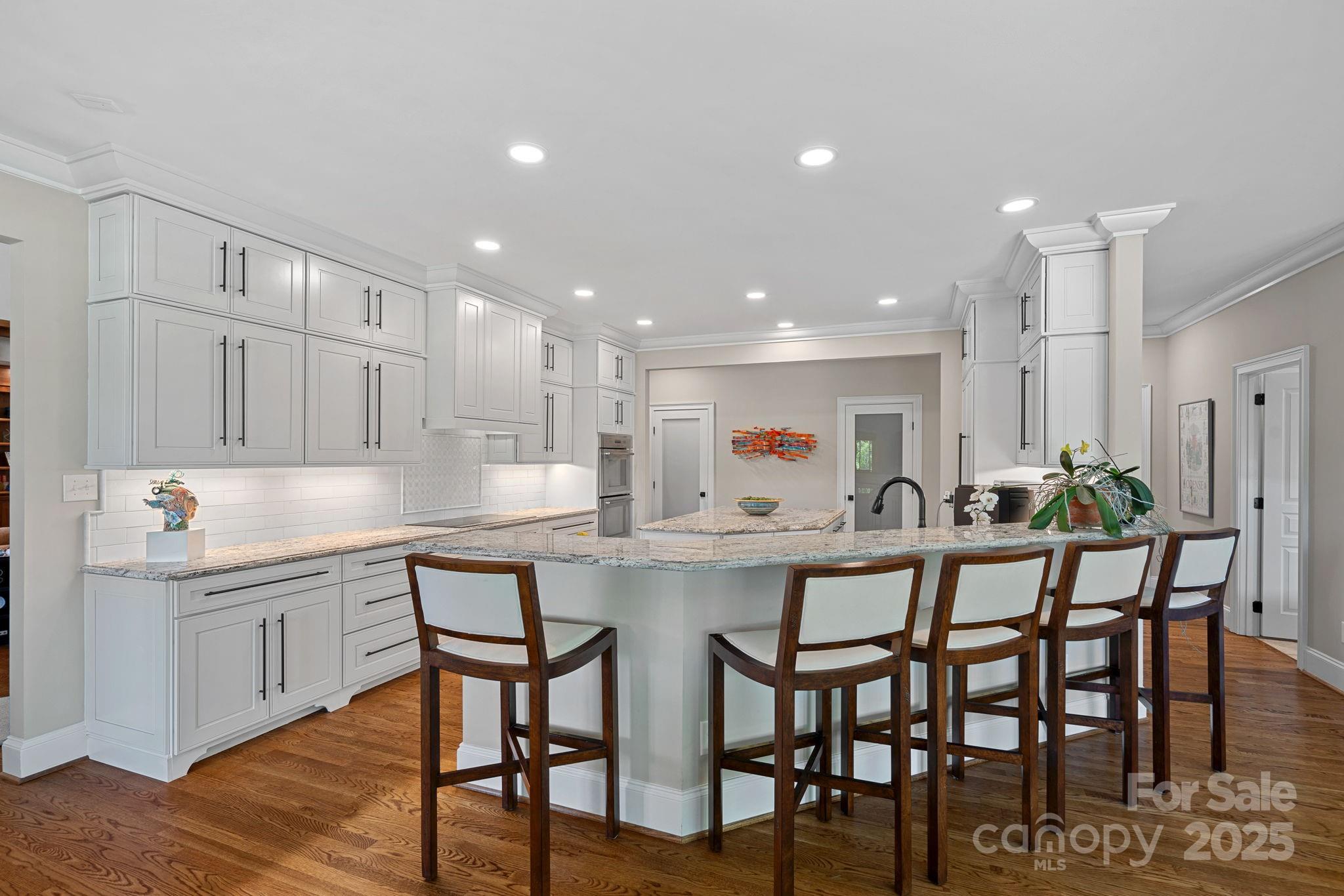 19501 River Falls Drive Davidson, NC 28036 - Photo 11 of 47 a kitchen with a table and chairs in it