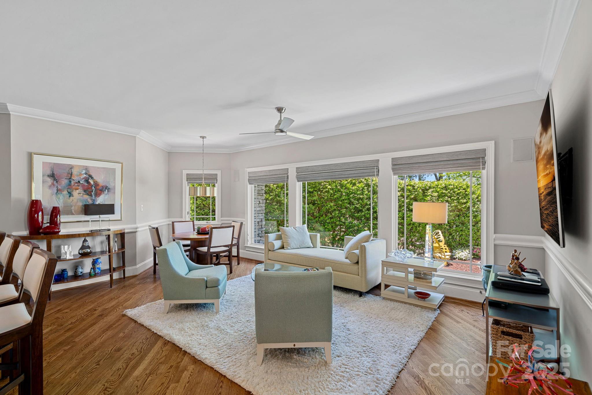 19501 River Falls Drive Davidson, NC 28036 - Photo 15 of 47 a living room with furniture and a flat screen tv