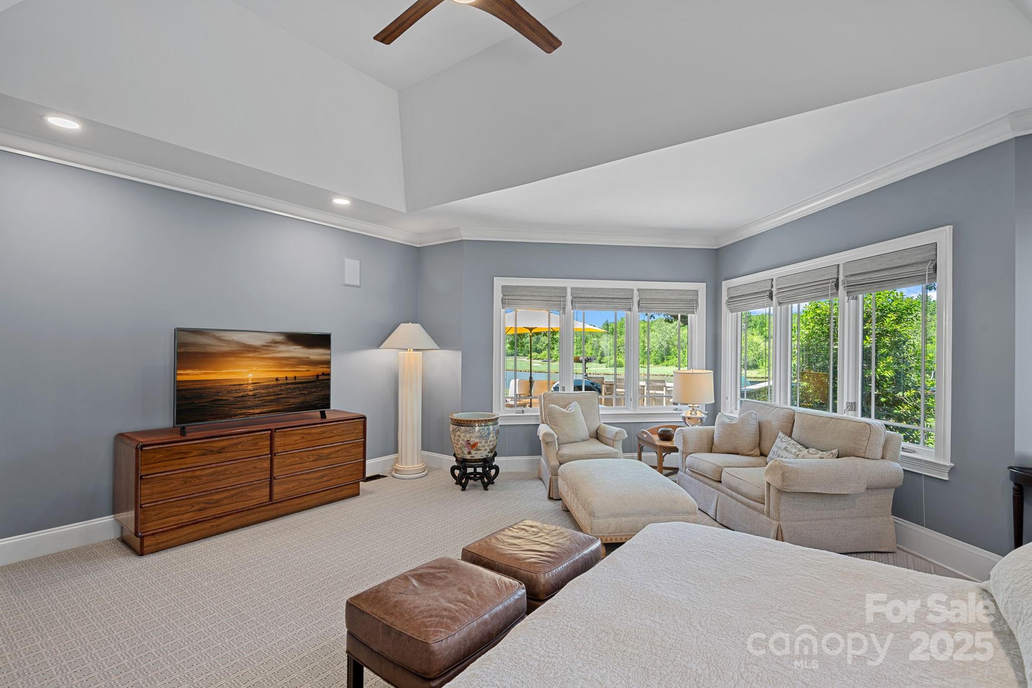 19501 River Falls Drive Davidson, NC 28036 - Photo 18 of 47 a living room with furniture and a flat screen tv