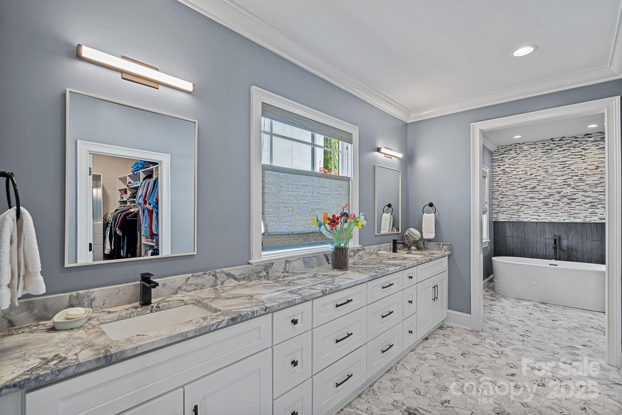 19501 River Falls Drive Davidson, NC 28036 - Photo 19 of 47 a bathroom with a granite countertop sink and a mirror