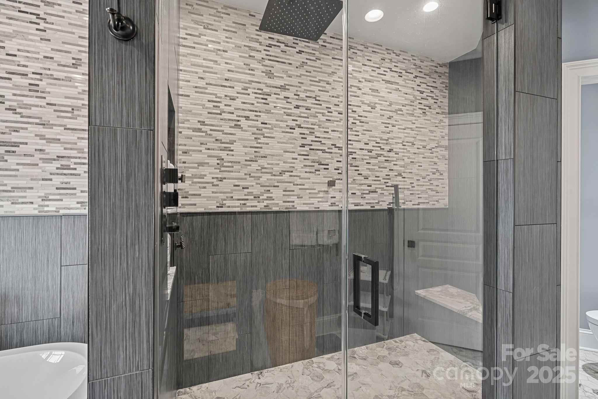 19501 River Falls Drive Davidson, NC 28036 - Photo 21 of 47 a bathroom with a shower and a sink