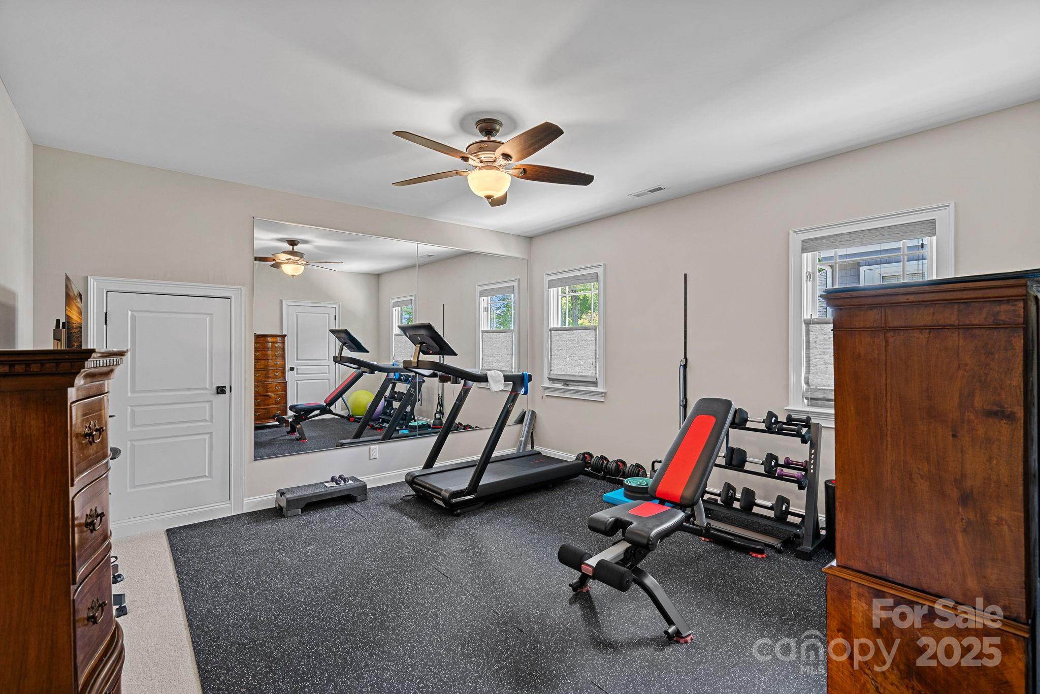 19501 River Falls Drive Davidson, NC 28036 - Photo 27 of 47 a view of a room with gym equipment