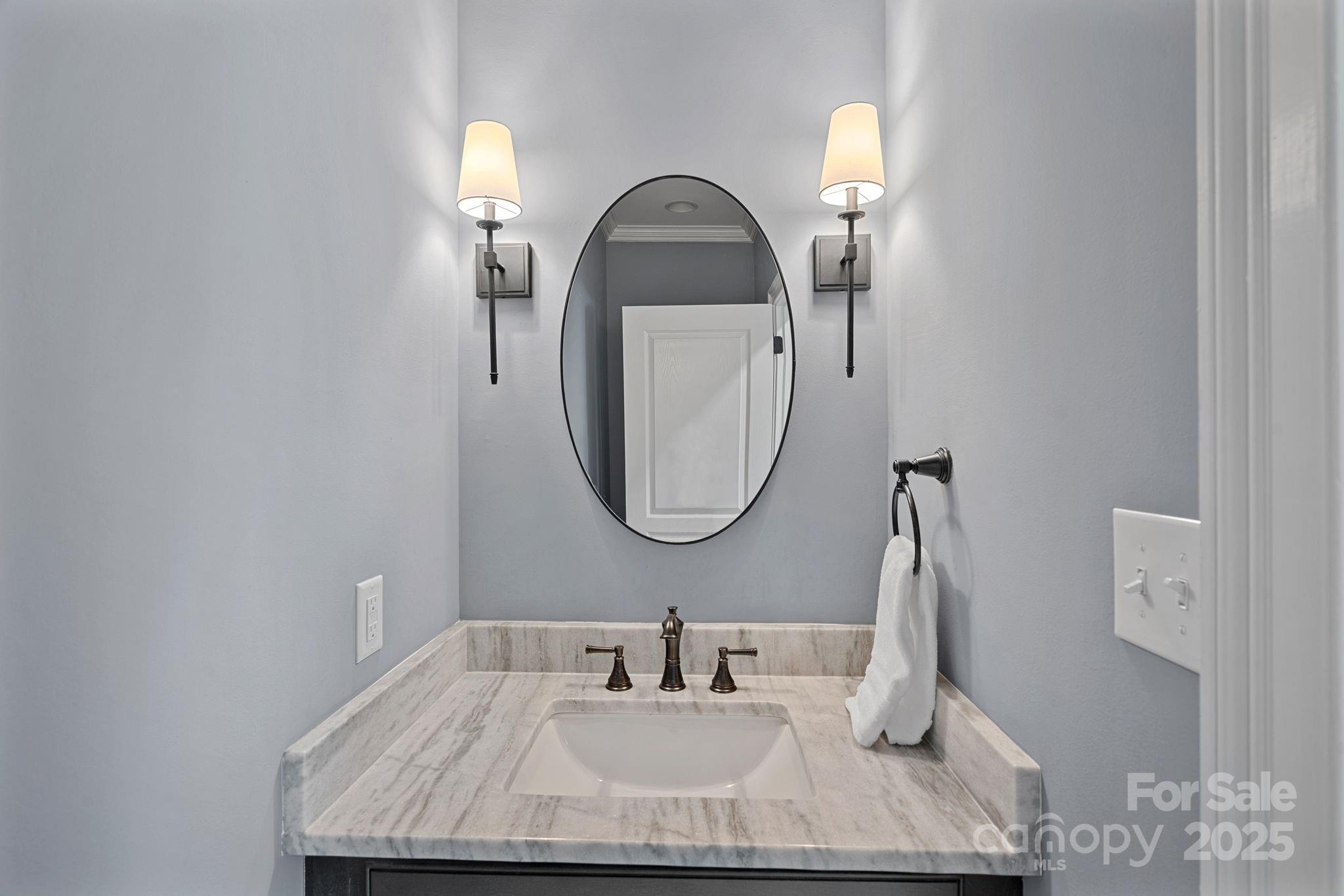 19501 River Falls Drive Davidson, NC 28036 - Photo 30 of 47 a bathroom with a sink and a mirror