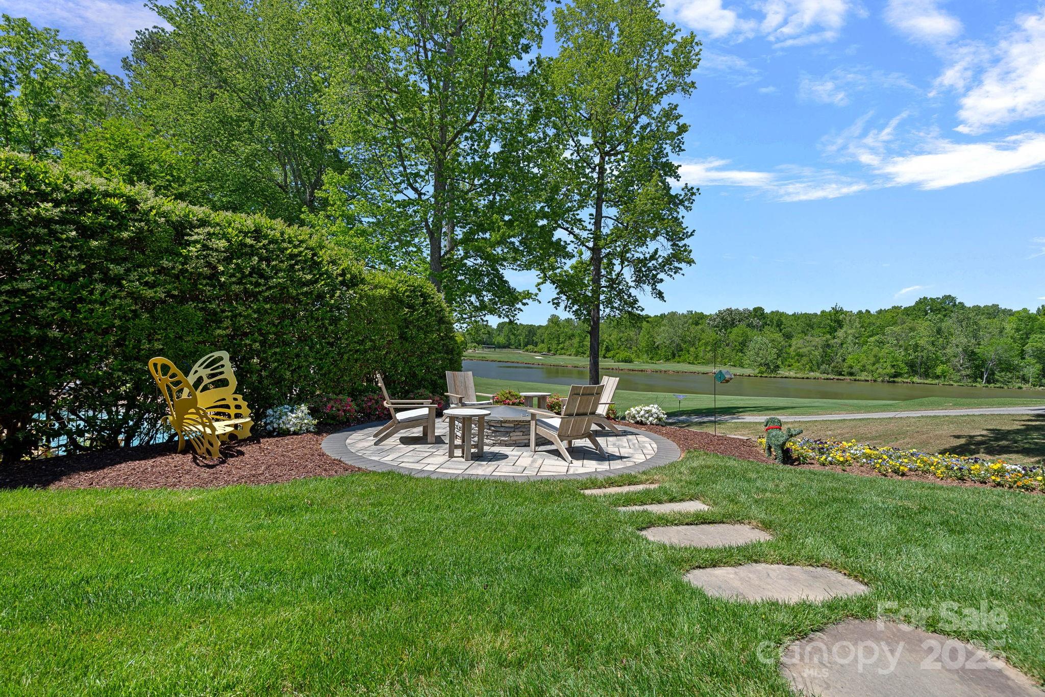19501 River Falls Drive Davidson, NC 28036 - Photo 38 of 47 a view of a park with large trees and a table