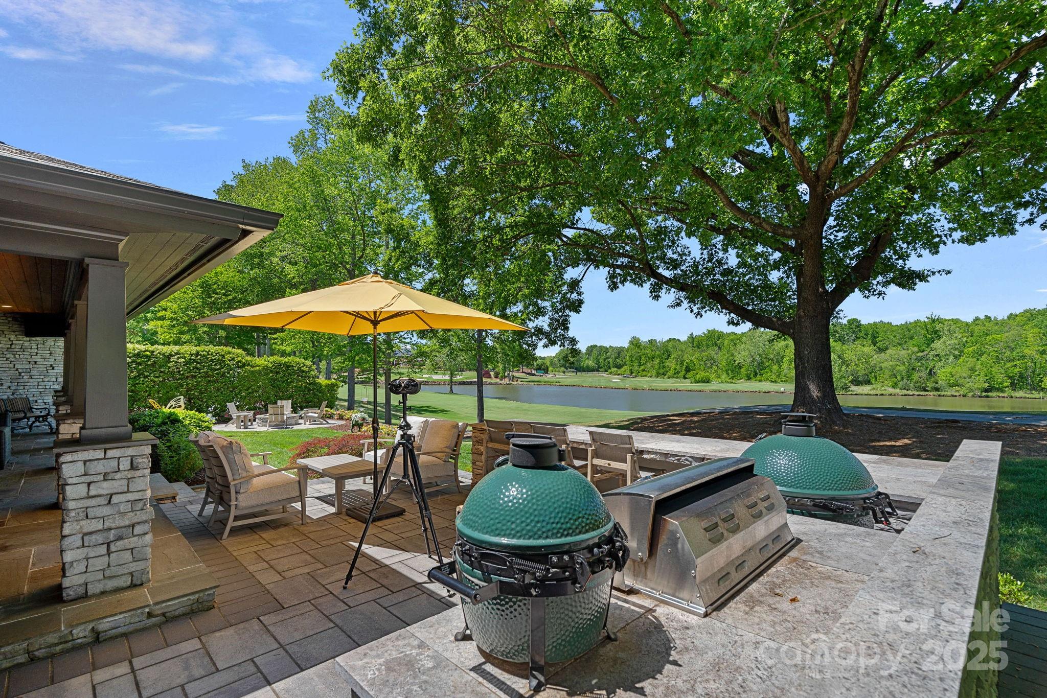 19501 River Falls Drive Davidson, NC 28036 - Photo 47 of 47 a backyard of a house with outdoor seating