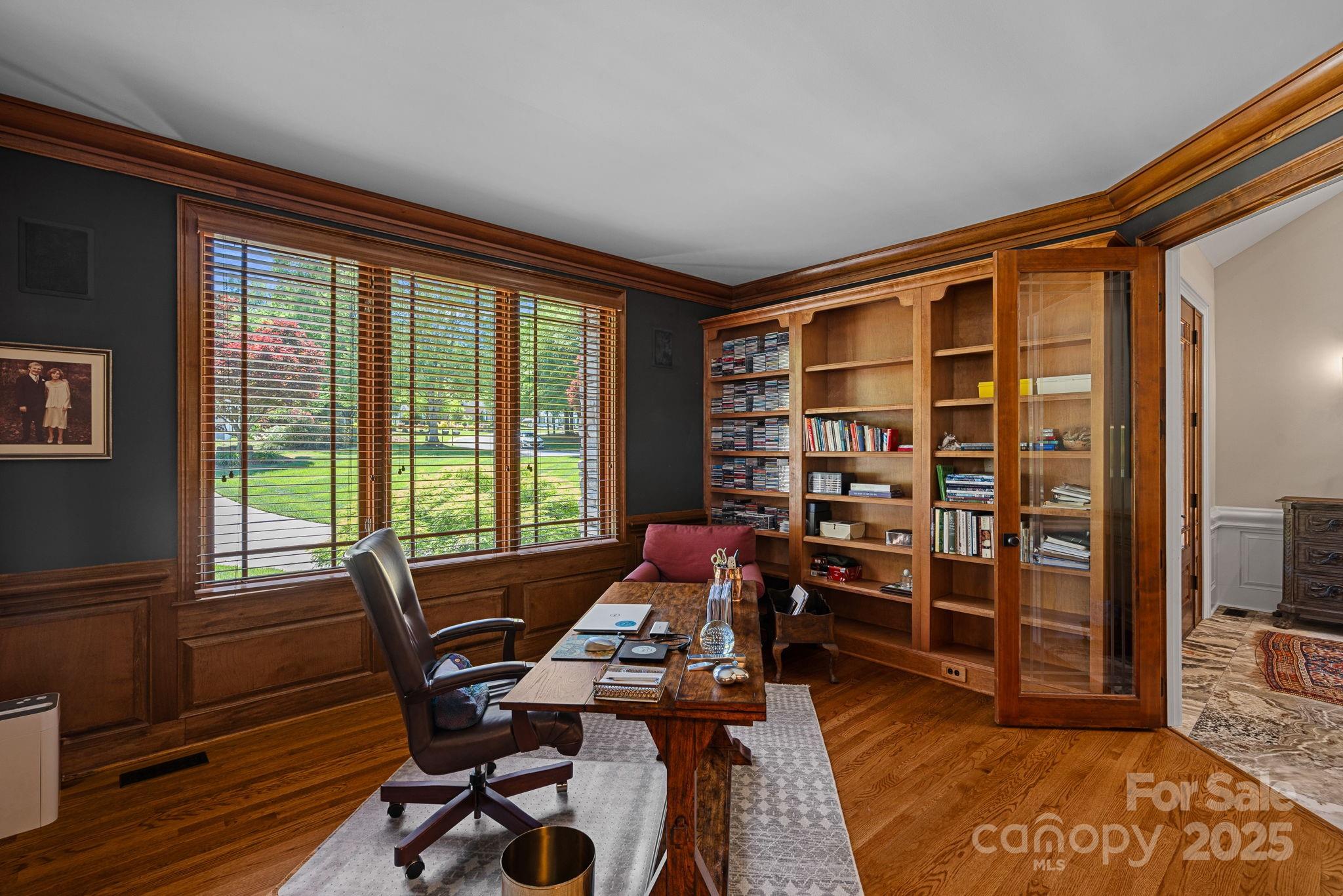 19501 River Falls Drive Davidson, NC 28036 - Photo 5 of 47 a view of a workspace with furniture and a window