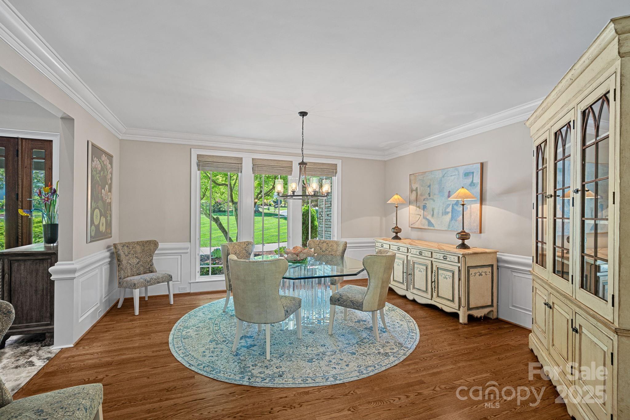 19501 River Falls Drive Davidson, NC 28036 - Photo 6 of 47 a living room with furniture a large window and wooden floor