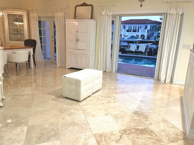 a spacious bedroom with a bed and a cabinets