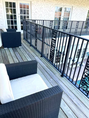 a view of balcony with wooden floor