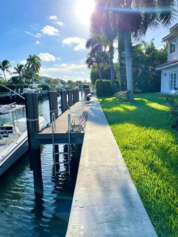 a group of people sitting in front of a house