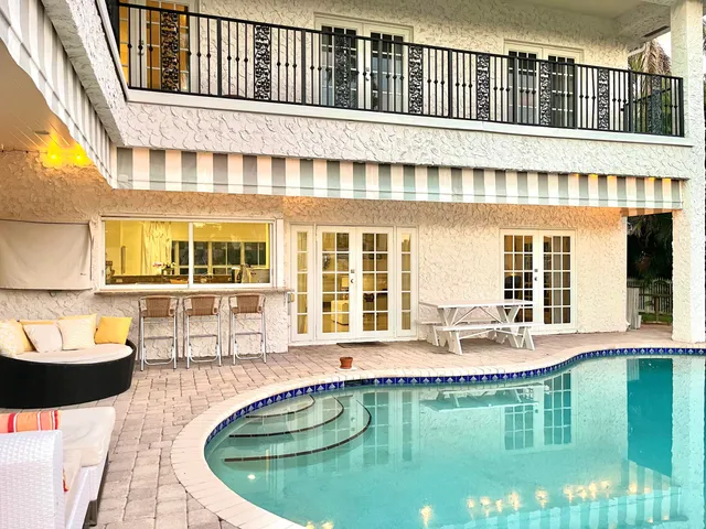 a view of a lake with boats and trees in the background