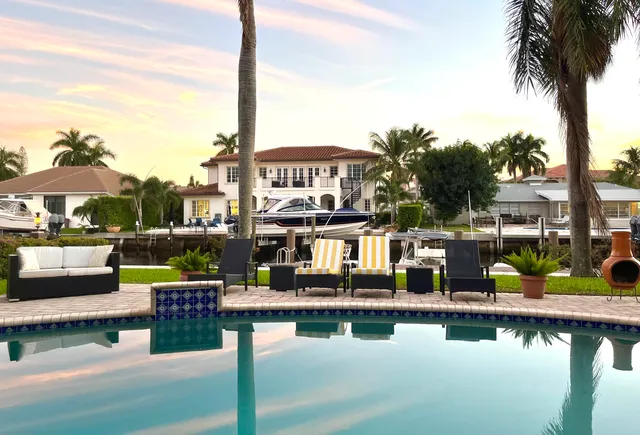 a view of a lake with couches and city view
